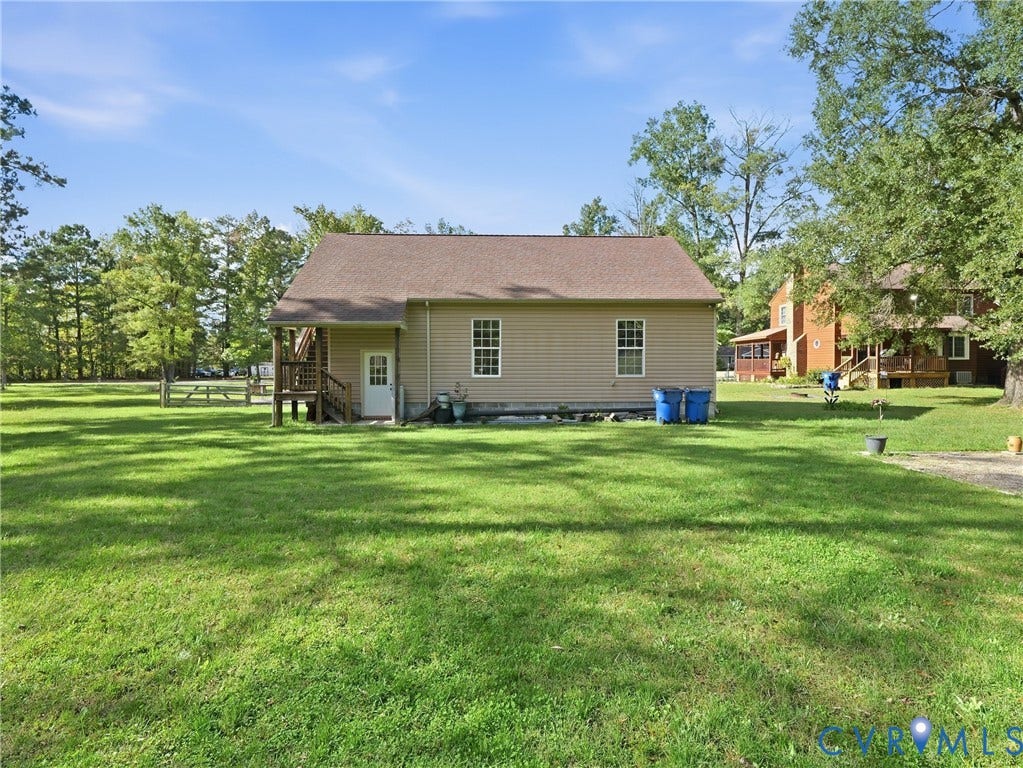 6723 Bull Hill Road, Prince George, VA 23875 Expansive lot featuring mature trees, a gable roof structure, horizontal siding, and a wooden elevated deck