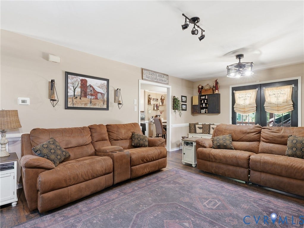 6723 Bull Hill Road, Prince George, VA 23875 Interior living area featuring dark wood-finish flooring, recessed track lighting, a multi-light ceiling fan, and built-in wall cabinetry