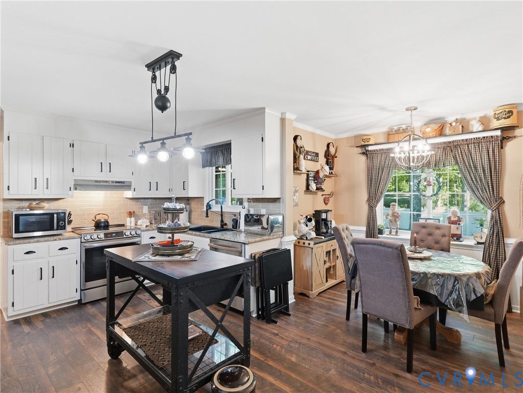 6723 Bull Hill Road, Prince George, VA 23875 Kitchen featuring white shaker-style cabinetry, stone countertops, industrial-style pulley pendant lighting, and wood-finish flooring