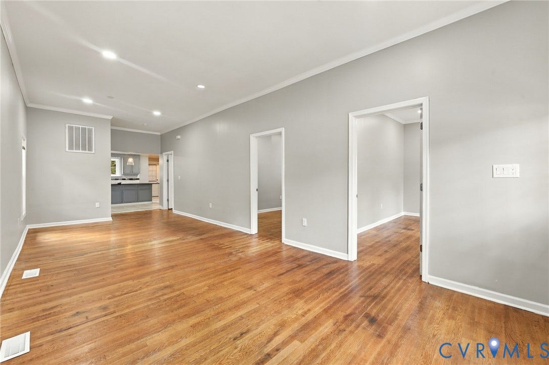 1432 Ferndale Avenue, Petersburg, VA 23803 Wood-finish flooring throughout, recessed ceiling lighting, light grey wall paint, white trim, and open doorways