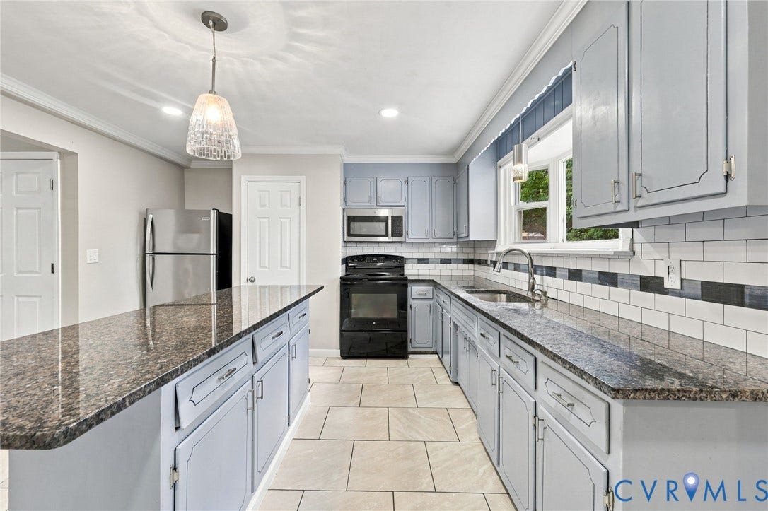 1432 Ferndale Avenue, Petersburg, VA 23803 Kitchen featuring light blue cabinetry, stone countertops, a subway tile backsplash, and a central island with pendant lighting