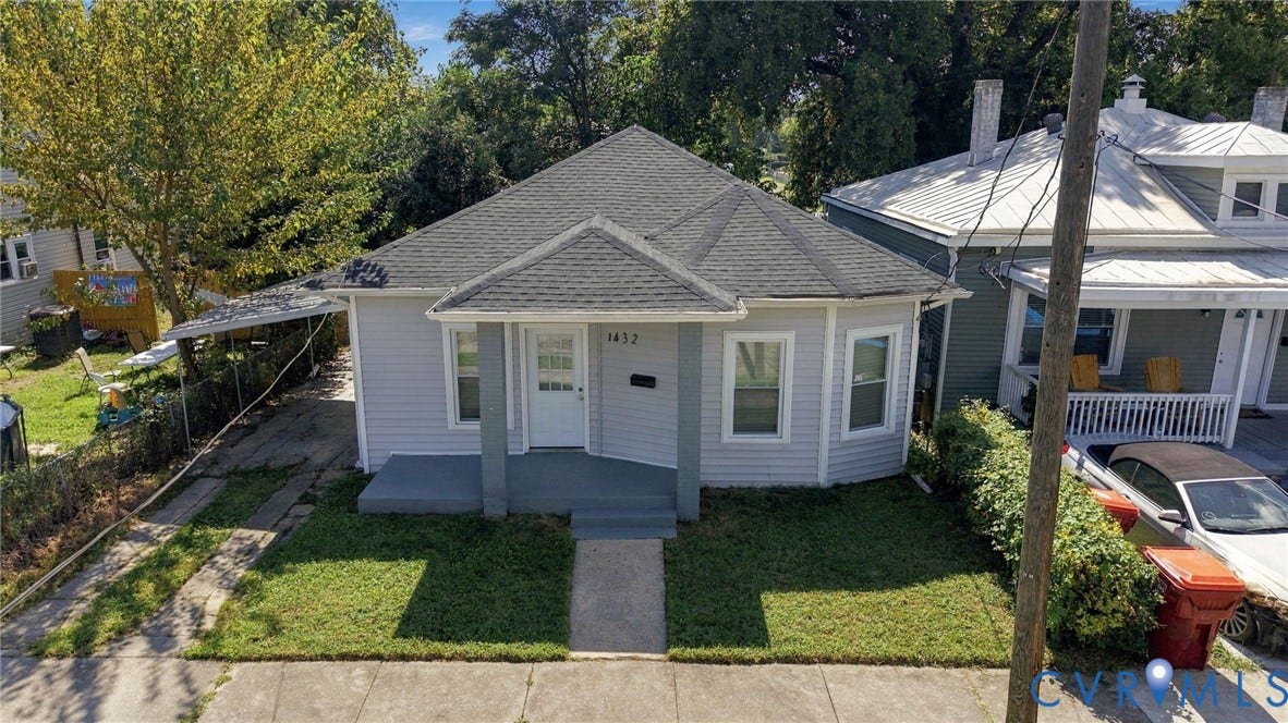 1432 Ferndale Avenue, Petersburg, VA 23803 Light gray siding exterior with a dark gray shingle roof