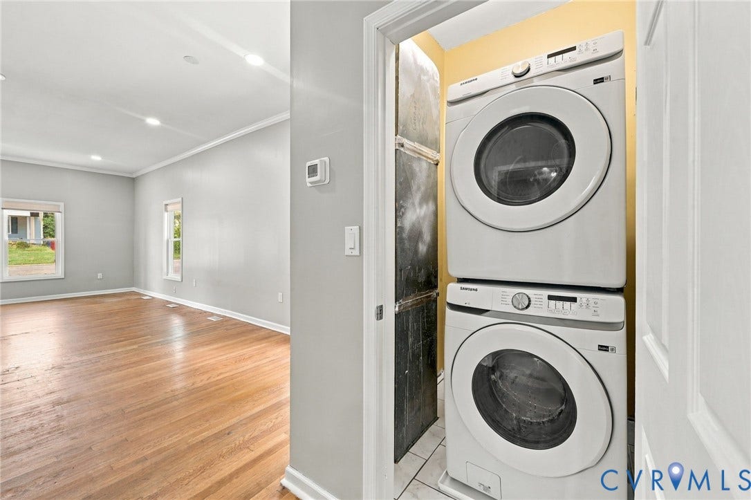 1432 Ferndale Avenue, Petersburg, VA 23803 Stacked washer and dryer unit, wood-finish flooring, recessed lighting, and crown molding