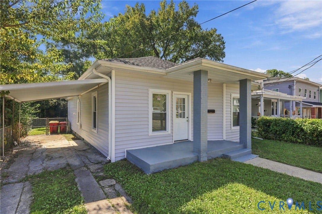 1432 Ferndale Avenue, Petersburg, VA 23803 Light-colored siding exterior with a covered front porch featuring two square columns and a concrete walkway