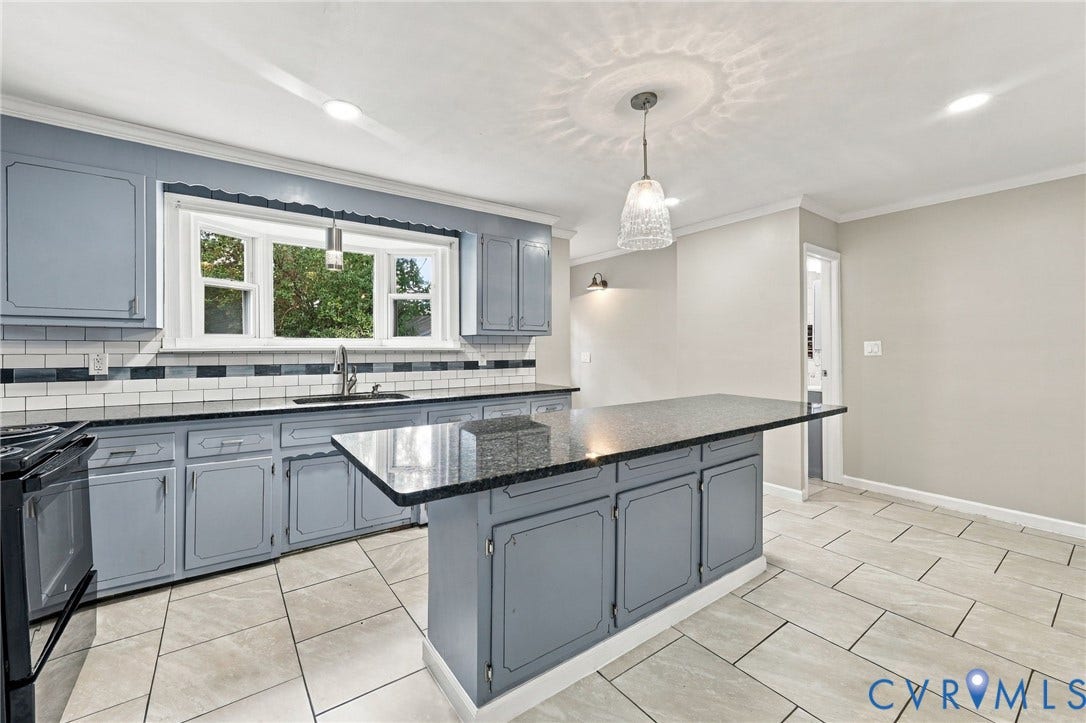1432 Ferndale Avenue, Petersburg, VA 23803 Kitchen featuring gray cabinetry, a central island with a dark countertop, white subway tile backsplash, and light-toned floor tiles