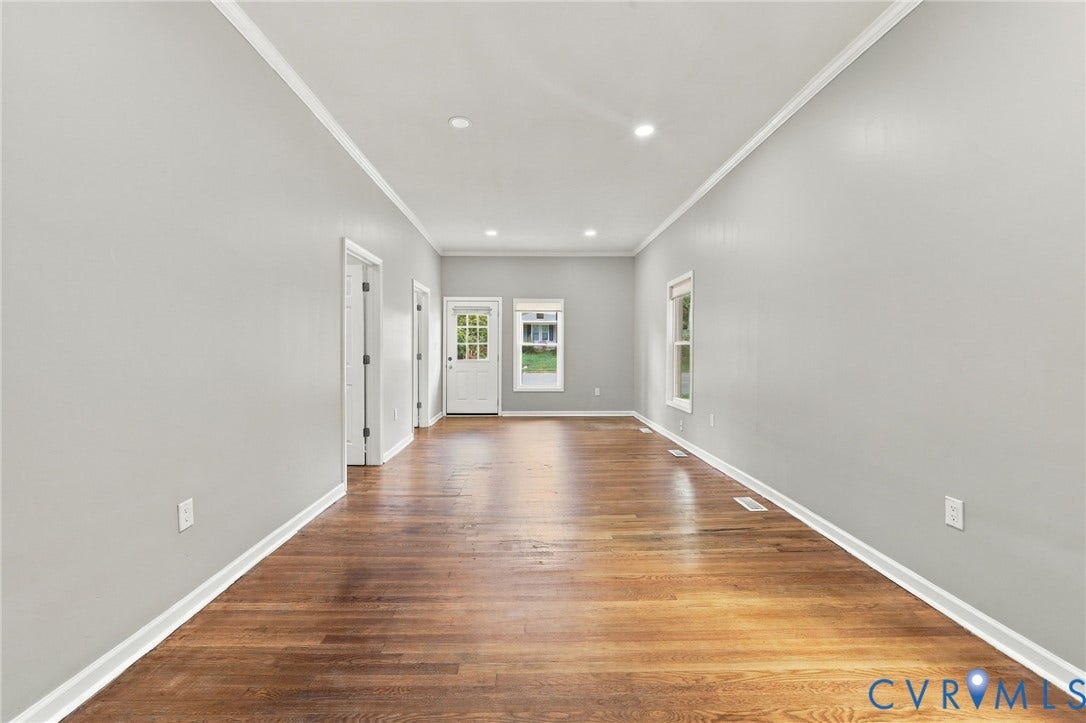 1432 Ferndale Avenue, Petersburg, VA 23803 Expansive room with wood-finish flooring, light gray walls, white trim, recessed lighting, and a glass-paneled exterior door