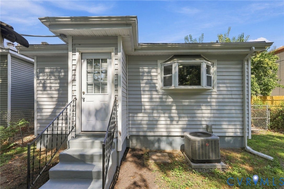 1432 Ferndale Avenue, Petersburg, VA 23803 Exterior with horizontal siding, a bay window, and a white entry door