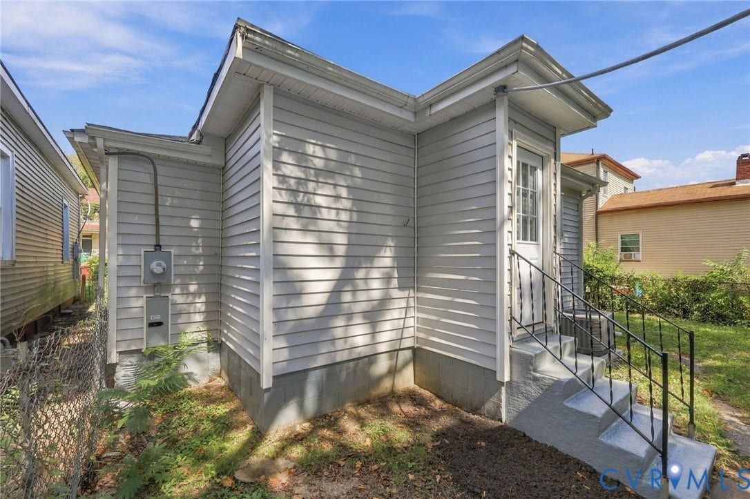 1432 Ferndale Avenue, Petersburg, VA 23803 Grey siding exterior with white trim, concrete steps, and black metal handrails