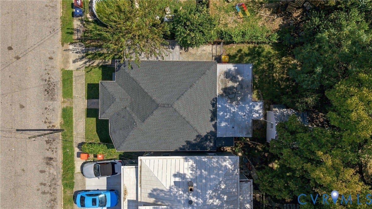 1432 Ferndale Avenue, Petersburg, VA 23803 Gable roof with dark shingles, paved driveway, and established trees