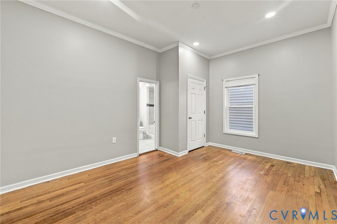 1432 Ferndale Avenue, Petersburg, VA 23803 Hardwood flooring, crown molding, recessed lighting, white trim, and a paneled interior door
