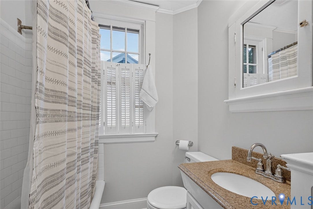3812 Fauquier Avenue, Bellevue, Richmond, VA 23227 White subway tile shower surround with a fixed showerhead