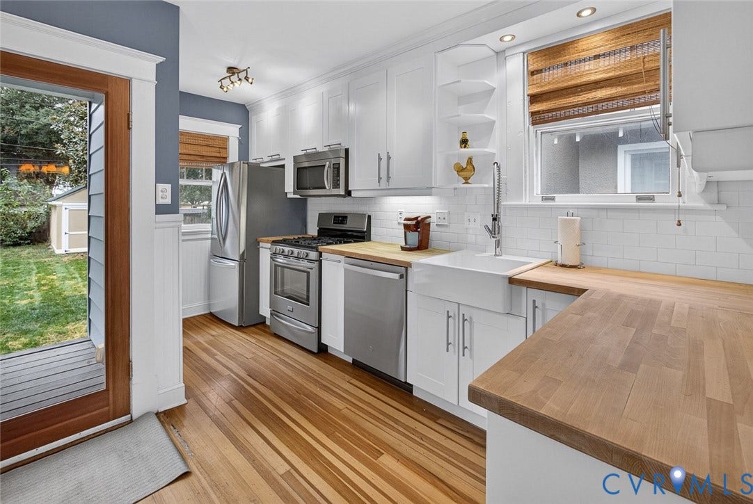 3812 Fauquier Avenue, Bellevue, Richmond, VA 23227 Kitchen featuring wood-finish flooring, white cabinetry, integrated stainless steel appliances, butcher block countertops, and a farmhouse sink