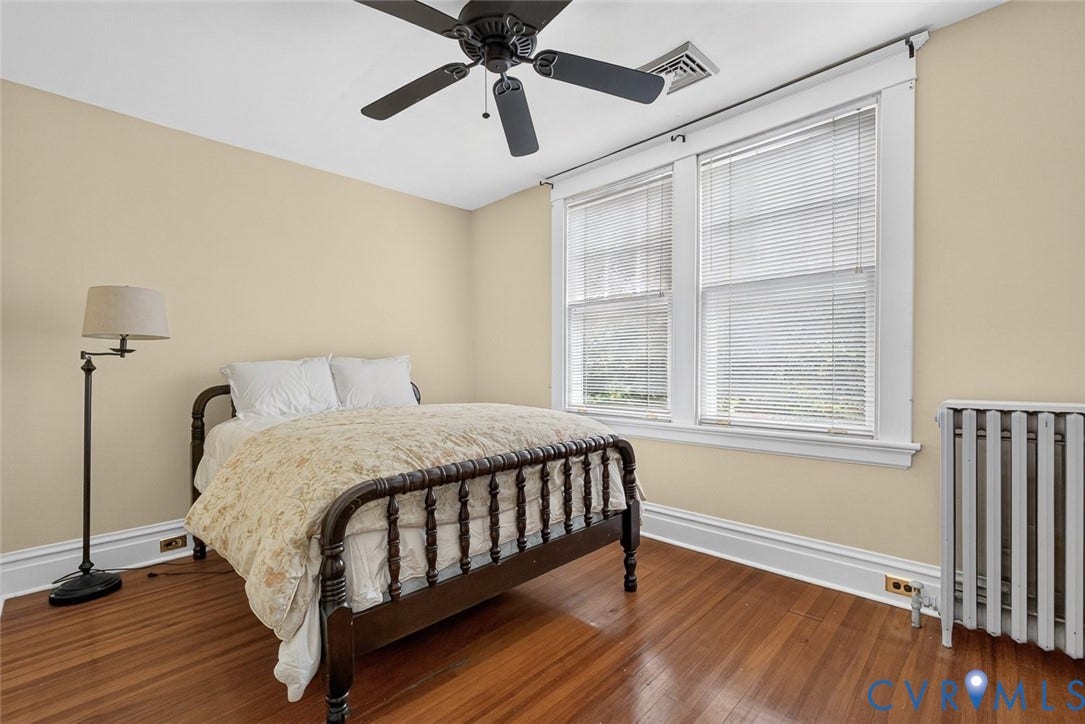 3812 Fauquier Avenue, Bellevue, Richmond, VA 23227 Hardwood flooring, two windows with blinds, a ceiling fan, and a radiator