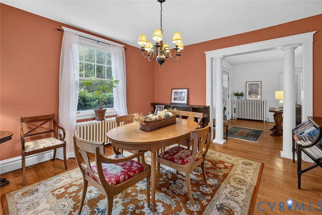 3812 Fauquier Avenue, Bellevue, Richmond, VA 23227 Hardwood flooring throughout, chandelier lighting, window with exterior landscaping, and a columned archway