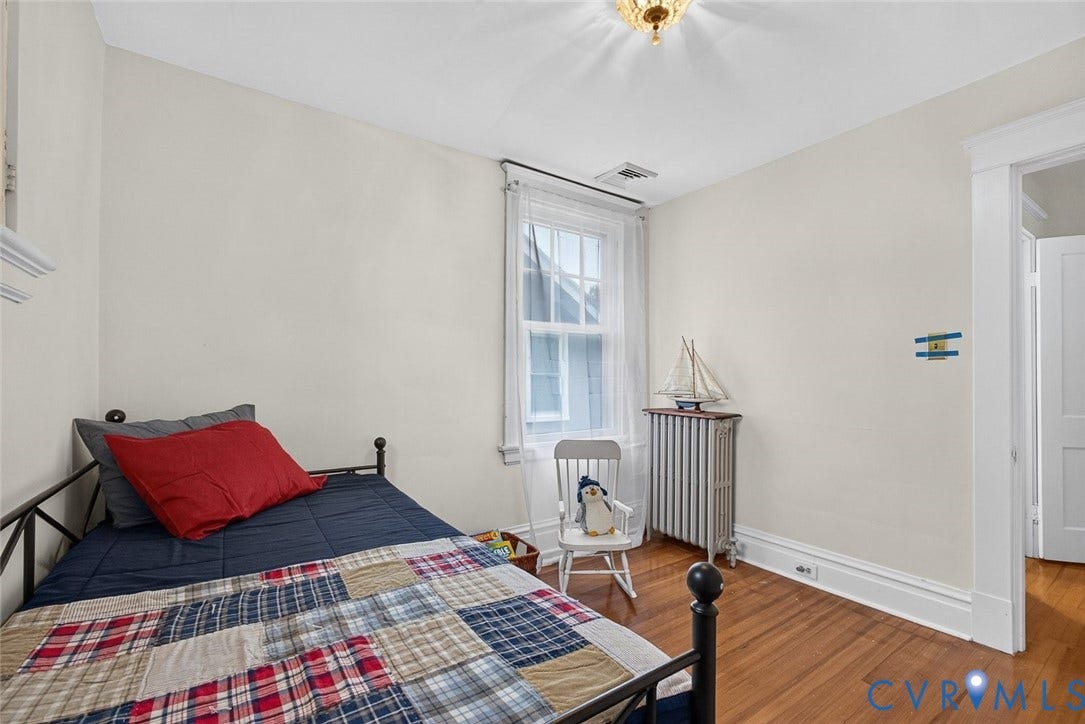 3812 Fauquier Avenue, Bellevue, Richmond, VA 23227 Hardwood flooring, painted walls, window with a white frame, and a ceiling-mounted light fixture
