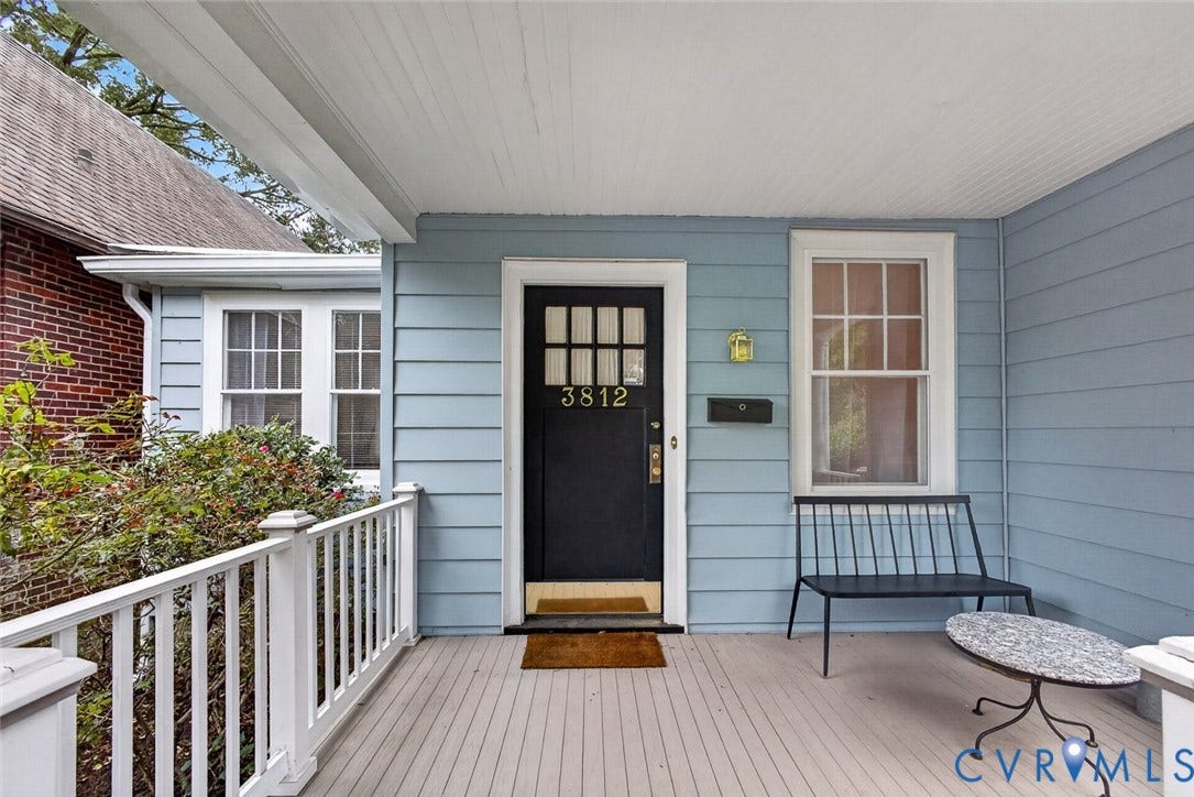 3812 Fauquier Avenue, Bellevue, Richmond, VA 23227 Covered front porch featuring light blue siding, white railings, and a dark entry door with window panes