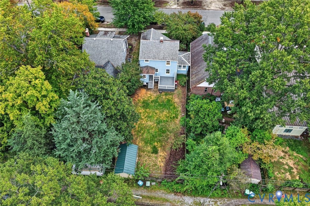 3812 Fauquier Avenue, Bellevue, Richmond, VA 23227 Expansive rear yard with a green storage shed and surrounding mature trees
