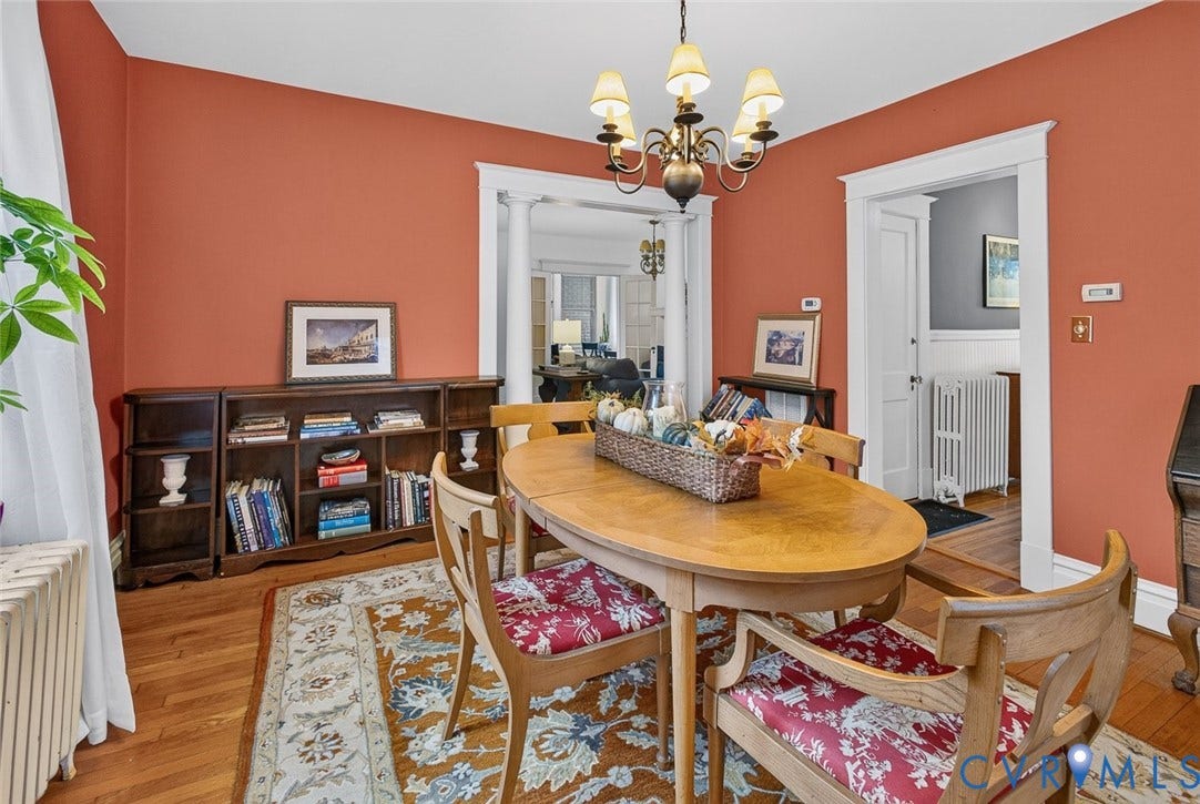 3812 Fauquier Avenue, Bellevue, Richmond, VA 23227 Hardwood flooring, decorative chandelier, built-in shelving, classic white trim, and architectural doorway