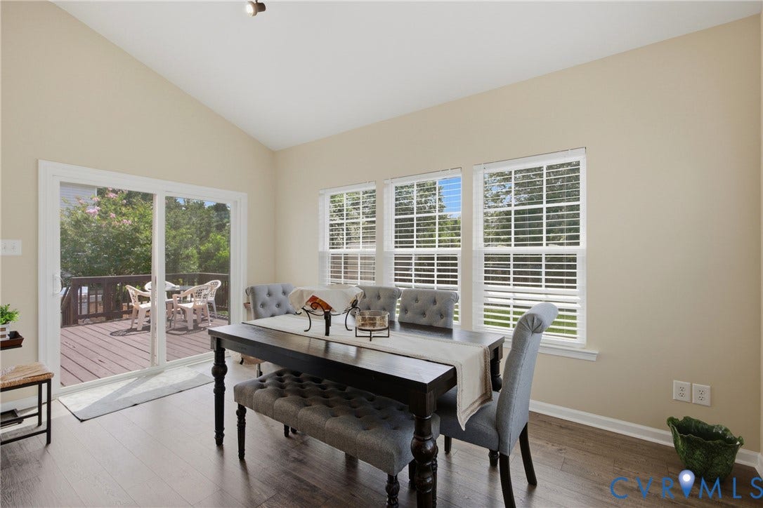 3536 Hunton Ridge Drive, Glen Allen, VA 23059 Vaulted ceiling with recessed lighting, wood-finish flooring, multiple windows with blinds, and a sliding glass door leading to an outdoor deck
