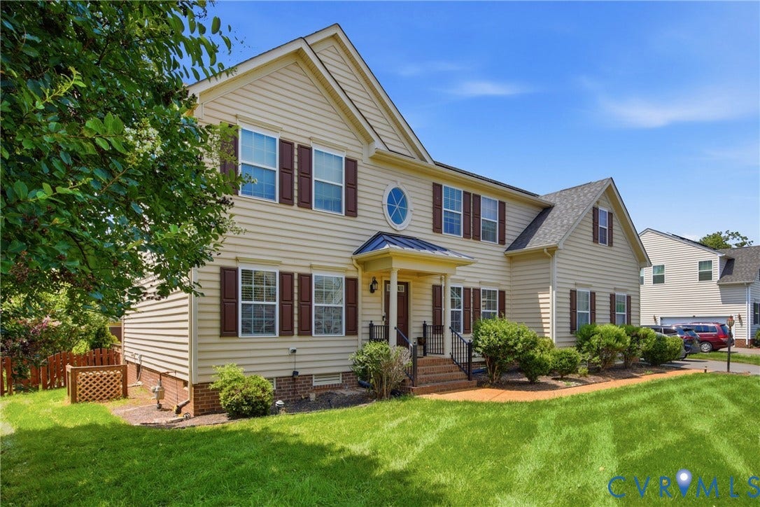 3536 Hunton Ridge Drive, Glen Allen, VA 23059 Two-story residence featuring light-colored siding, dark shutters, and a prominent front entrance with a covered porch
