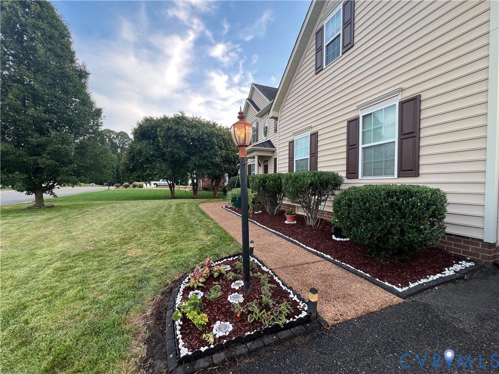 3536 Hunton Ridge Drive, Glen Allen, VA 23059 Siding exterior with brown shutters, mature landscaping, and a paved walkway leading to the entrance