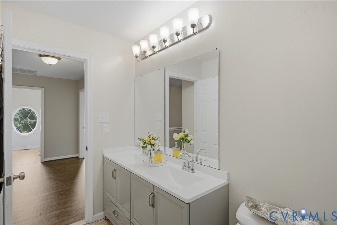3536 Hunton Ridge Drive, Glen Allen, VA 23059 Double vanity with gray cabinetry and white countertop, dual mirrors, and brushed nickel light fixture