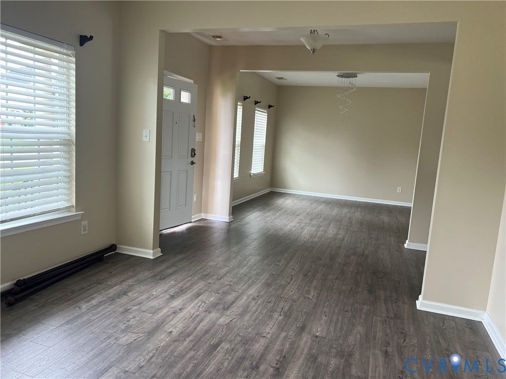 3536 Hunton Ridge Drive, Glen Allen, VA 23059 Wood-finish flooring throughout, with a white paneled entry door and a decorative ceiling fixture