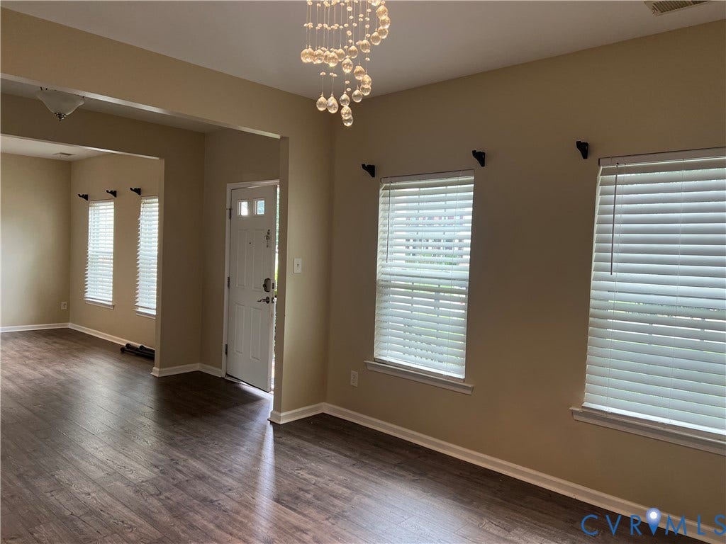 3536 Hunton Ridge Drive, Glen Allen, VA 23059 Wood-finish flooring, multiple windows with blinds, recessed entry, and a decorative ceiling light fixture