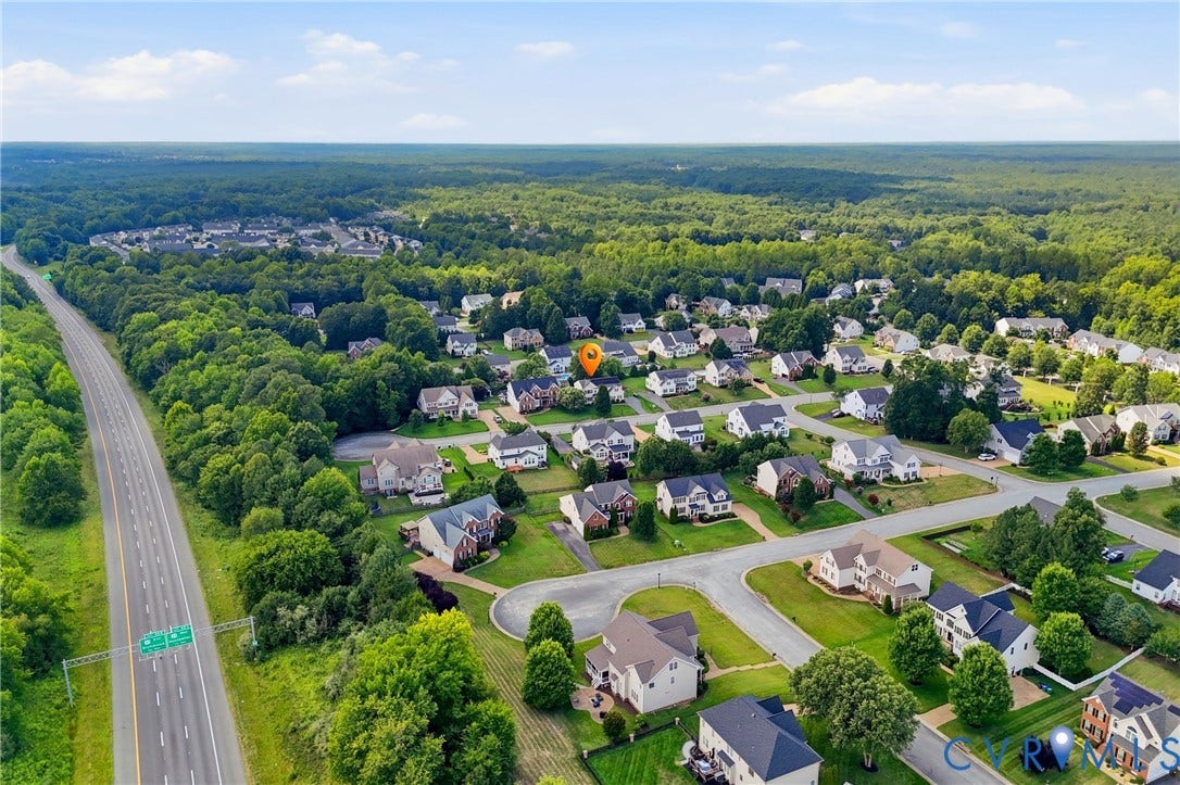 3536 Hunton Ridge Drive, Glen Allen, VA 23059 Residential neighborhood setting with mature trees and a highway in the foreground