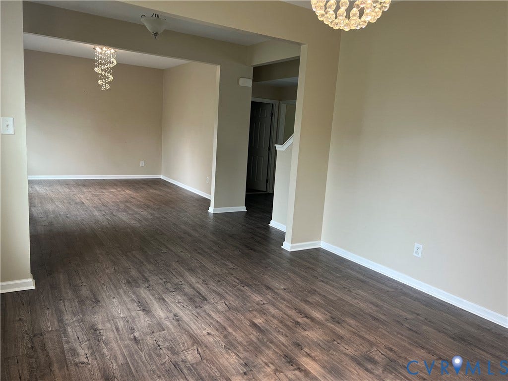 3536 Hunton Ridge Drive, Glen Allen, VA 23059 Wood-finish flooring throughout, neutral wall paint, white trim, and a contemporary chandelier fixture