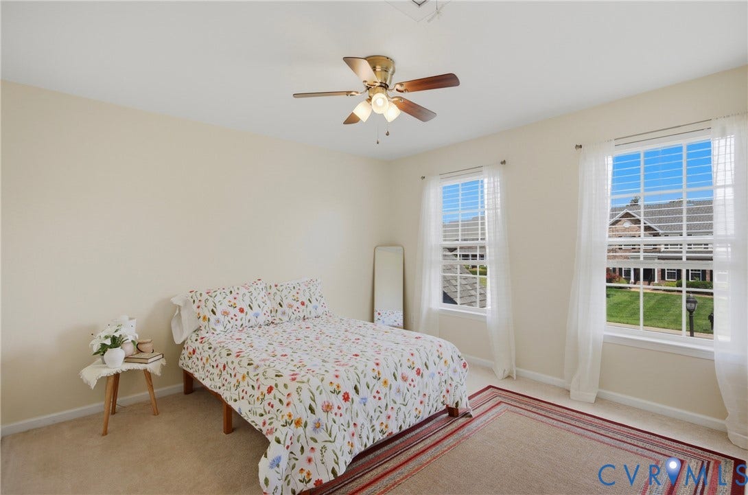 3536 Hunton Ridge Drive, Glen Allen, VA 23059 Neutral tone wall paint, dual windows with white trim, a ceiling fan with integrated lighting, and carpeted flooring