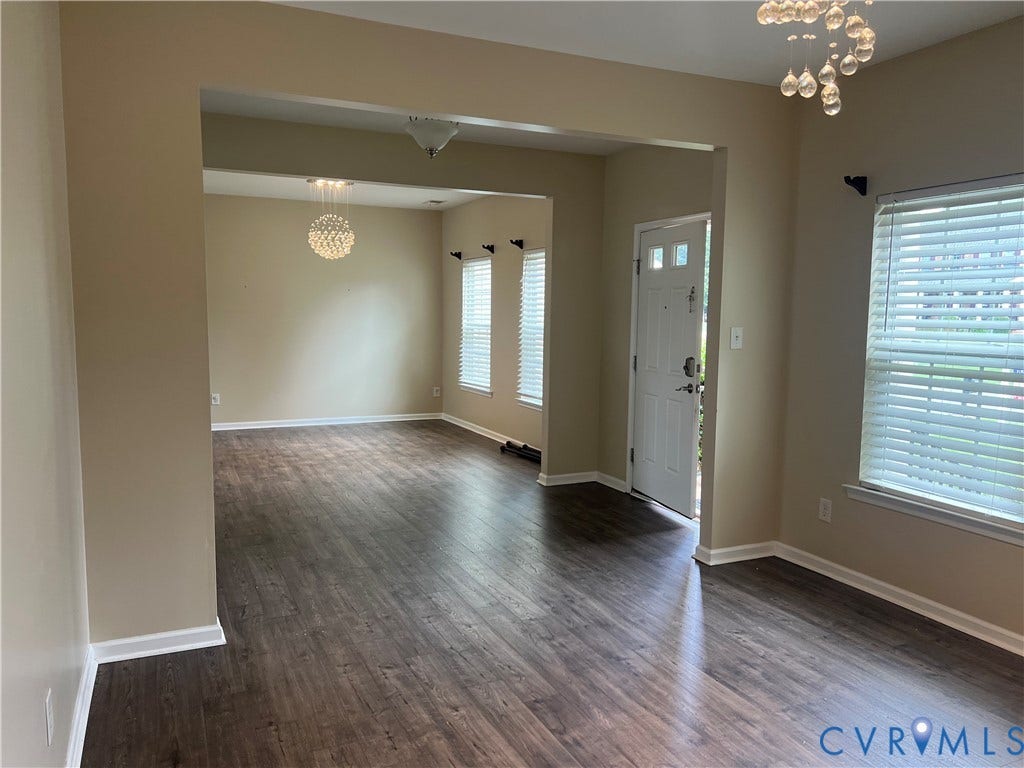 3536 Hunton Ridge Drive, Glen Allen, VA 23059 Wood-finish flooring throughout, neutral wall tones, decorative ceiling light fixtures, and a paneled entry door with frosted glass inserts