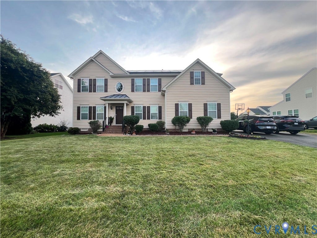 3536 Hunton Ridge Drive, Glen Allen, VA 23059 Two-story residence with a light-colored siding exterior and dark shutters