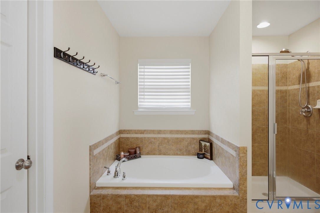 3536 Hunton Ridge Drive, Glen Allen, VA 23059 Built-in soaking tub with tile surround, paired with a glass-enclosed shower featuring a tiled interior