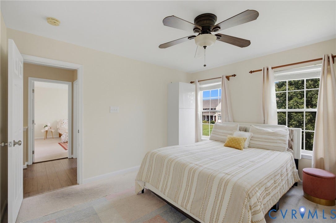 3536 Hunton Ridge Drive, Glen Allen, VA 23059 Dual pane windows, ceiling fan with integrated lighting, neutral wall tones, carpeted flooring, and a white paneled door