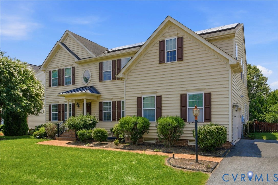 3536 Hunton Ridge Drive, Glen Allen, VA 23059 Two-story residence featuring light-toned siding, dark shutters, and a covered entry