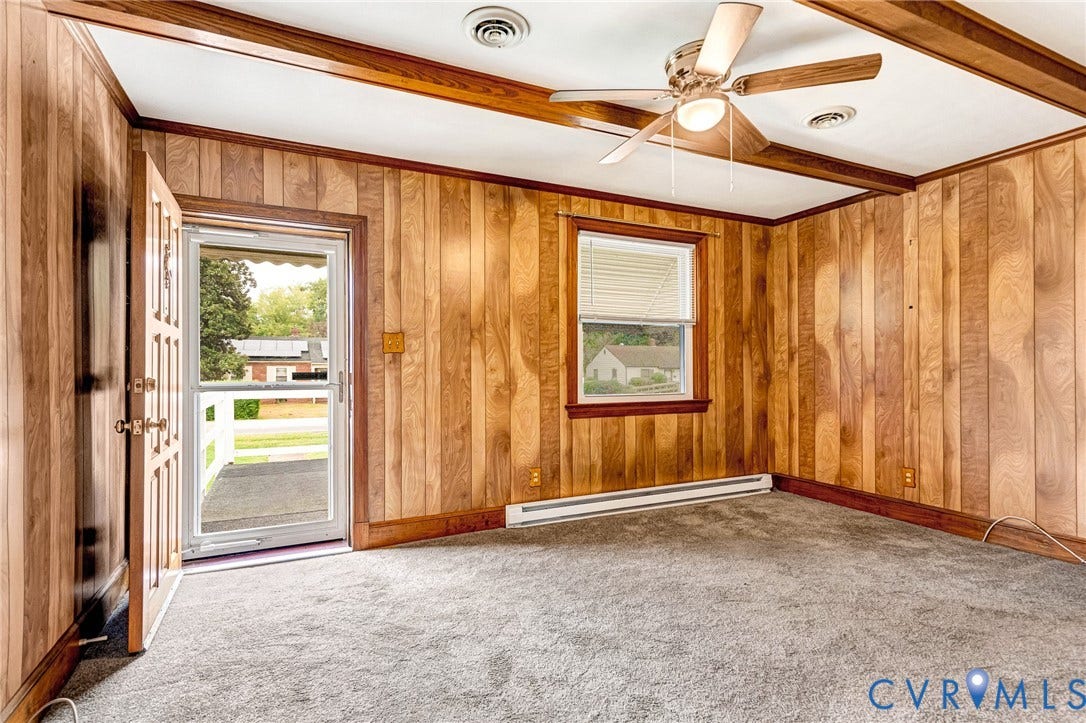 2503 Carlisle Avenue, Henrico, VA 23231 Wood-paneled room featuring a ceiling fan, exposed wood beams, and a single window with blinds