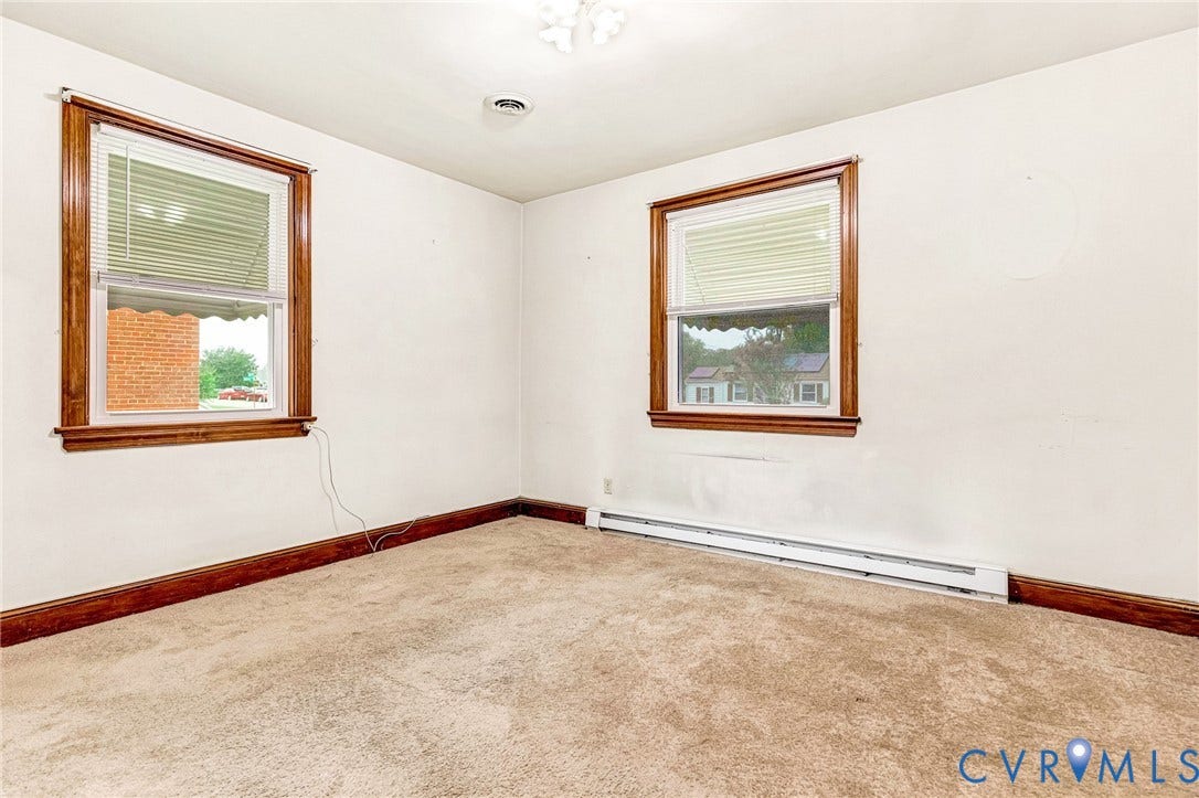 2503 Carlisle Avenue, Henrico, VA 23231 Carpet flooring, white walls, and two windows with wood-trim casings