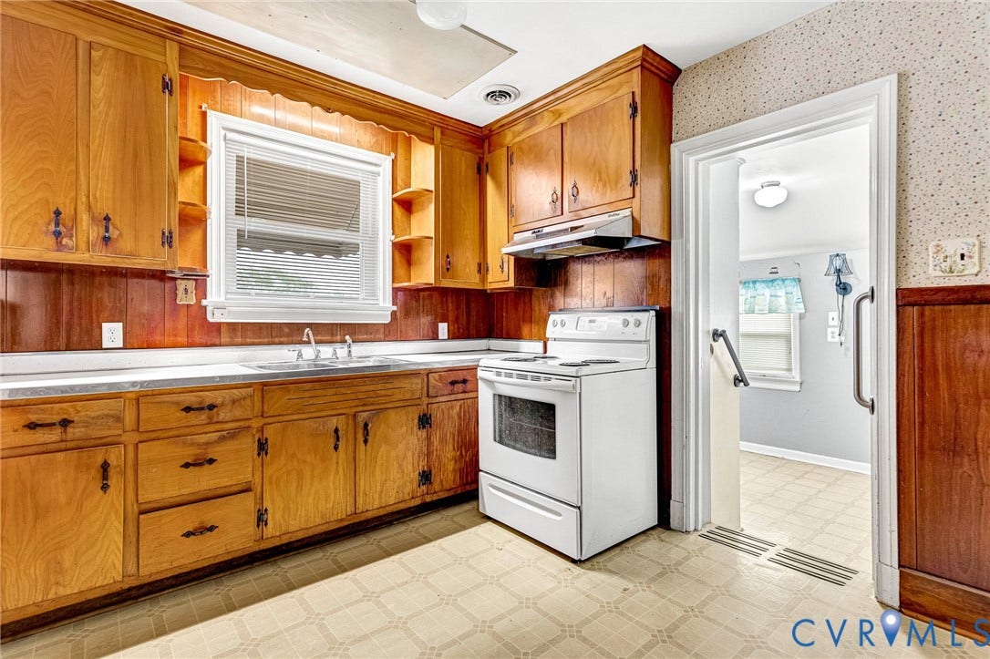 2503 Carlisle Avenue, Henrico, VA 23231 Kitchen with wood cabinetry, white countertop, and white range