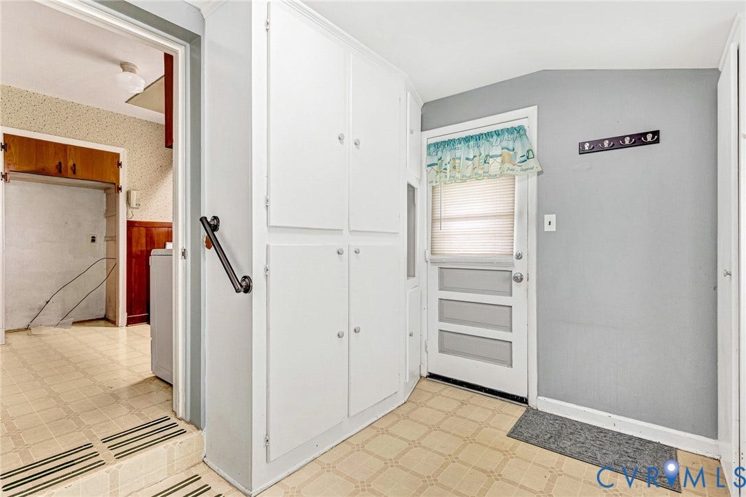 2503 Carlisle Avenue, Henrico, VA 23231 Built-in white cabinetry, exterior door with window, and neutral tone flooring