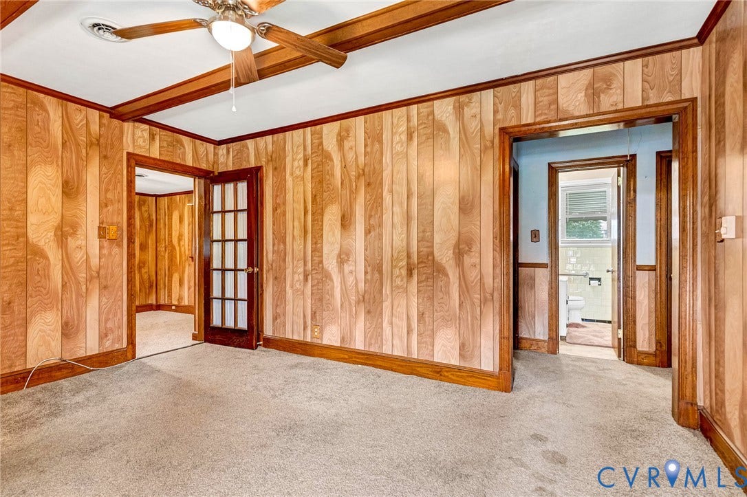 2503 Carlisle Avenue, Henrico, VA 23231 Carpeted interior space with wood paneling and wood-finish trim