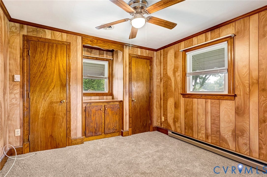 2503 Carlisle Avenue, Henrico, VA 23231 Wood-paneled walls with coordinating trim, neutral carpet flooring, and a ceiling fan with integrated lighting