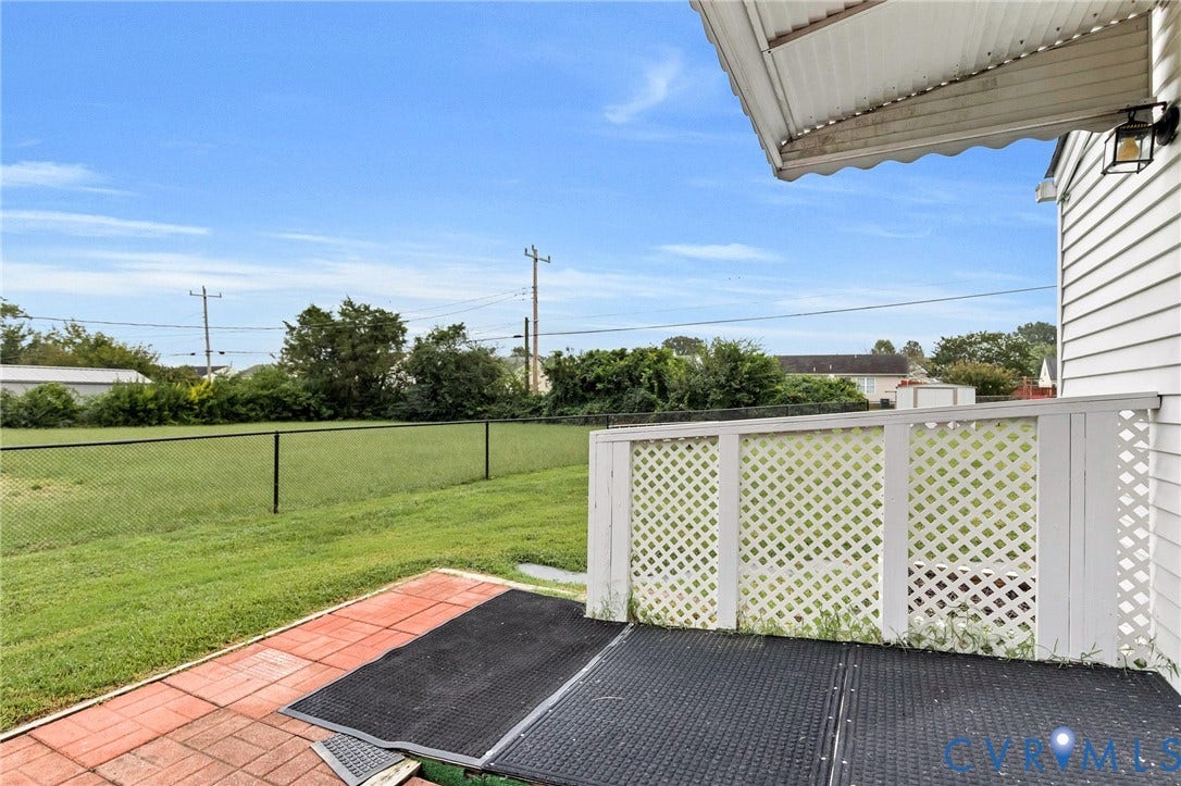 2503 Carlisle Avenue, Henrico, VA 23231 Patio with brick-style pavers and a black chain link fence