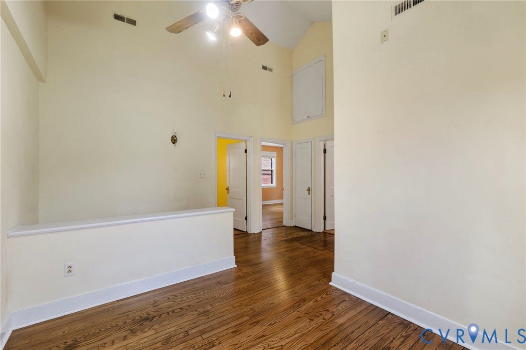 2714 E Broad Street, Church Hill, Richmond, VA 23223 Vaulted ceiling, ceiling fan, wood-finish flooring, white trim, and white paneled doors