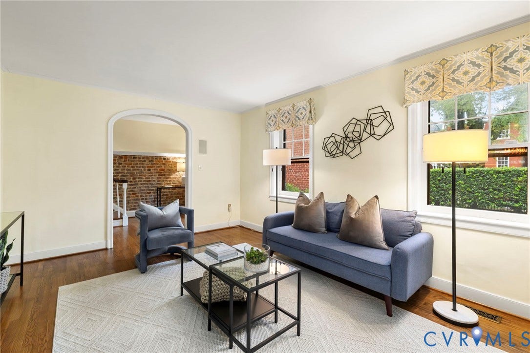 2714 E Broad Street, Church Hill, Richmond, VA 23223 Hardwood flooring, arched doorway, white trim, multiple windows, light wall tones
