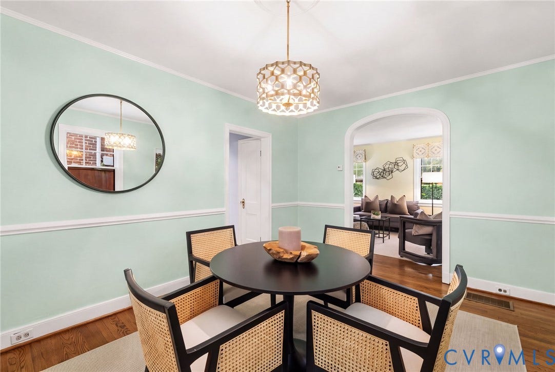 2714 E Broad Street, Church Hill, Richmond, VA 23223 Hardwood flooring, decorative wall molding, arched entryway, and a contemporary ceiling fixture