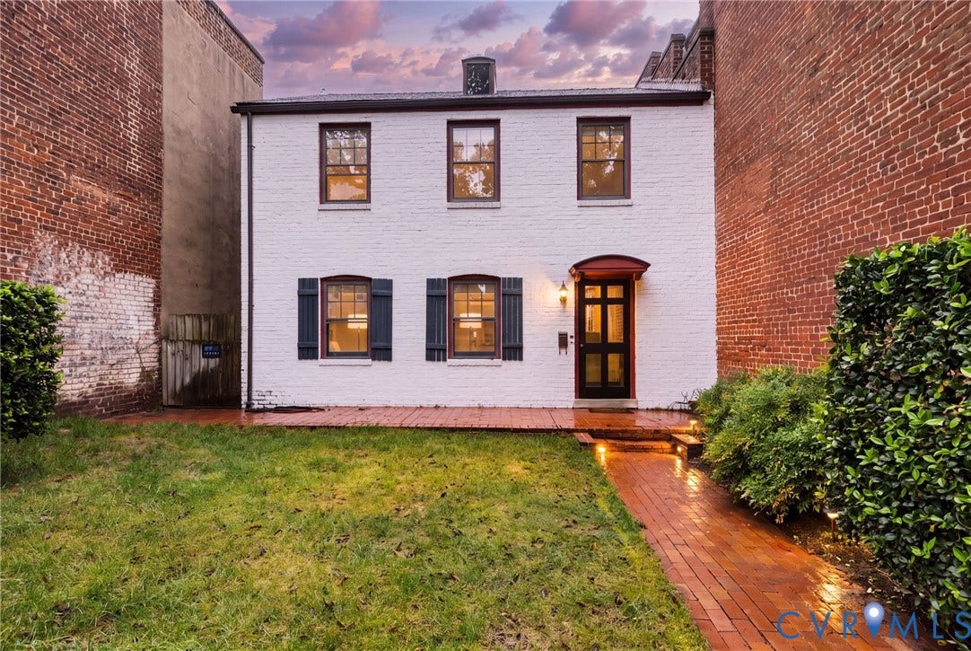 2714 E Broad Street, Church Hill, Richmond, VA 23223 White painted brick exterior with black shutters