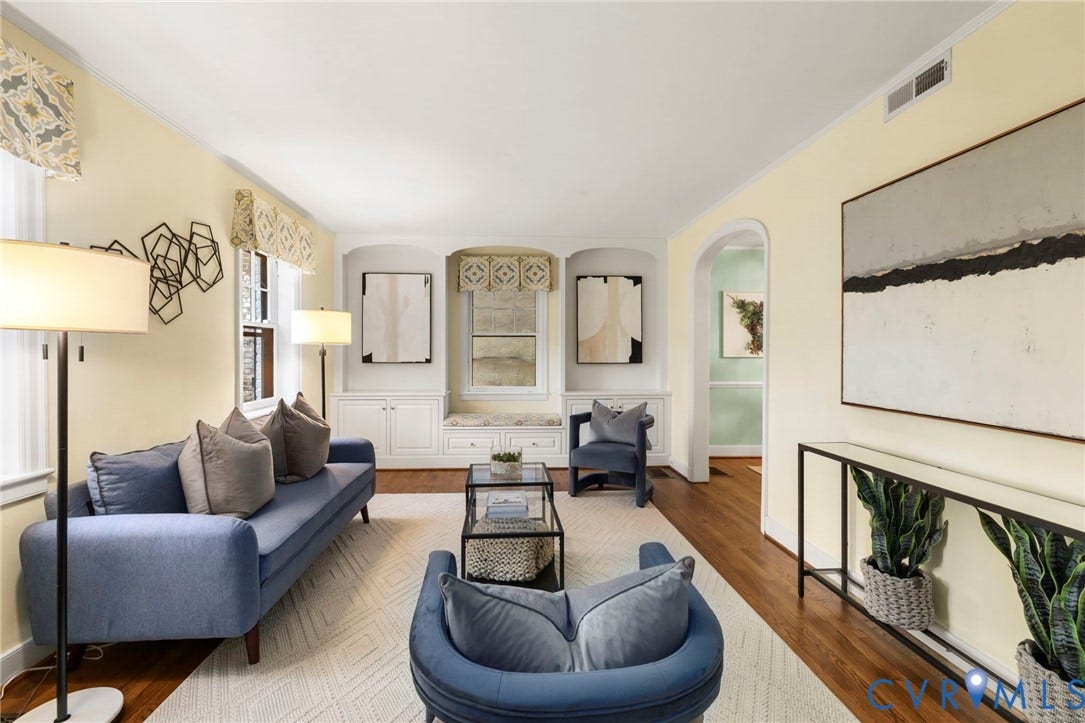 2714 E Broad Street, Church Hill, Richmond, VA 23223 Built-in cabinetry, arched entryway, wood-finish flooring, recessed built-in shelving, and crown molding