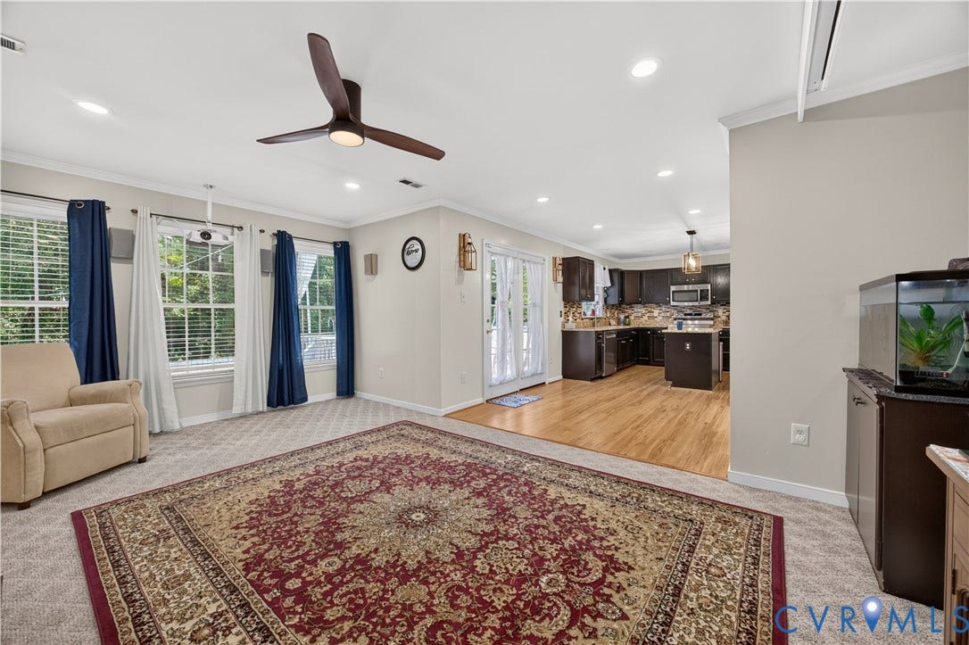9516 Hungary Woods Drive, Henrico, VA 23060 Recessed lighting throughout, ceiling fan with integrated light, and three large windows for a beautiful backyard view.