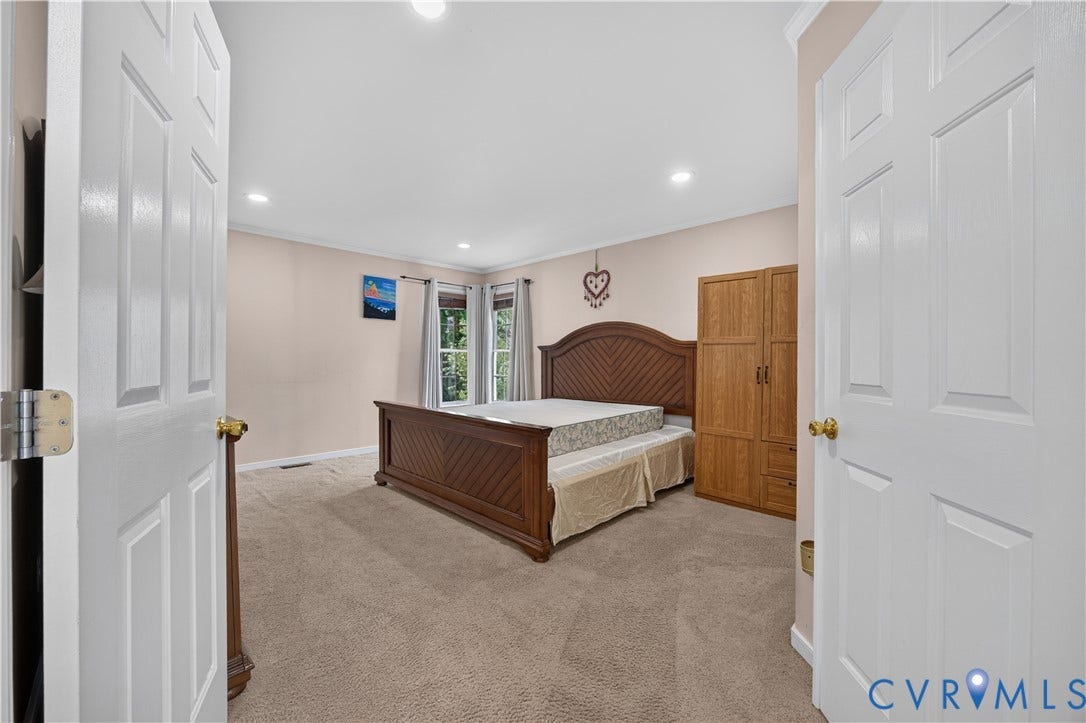 9516 Hungary Woods Drive, Henrico, VA 23060 Carpeted flooring, recessed lighting, and ample natural light from multiple windows with walk in closet.